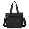 Bolsa de tela de nailon 2026 nuevo estilo de verano para mujer urbana simple bolso de mano de un solo hombro bolso tote cruzado casual para mujer