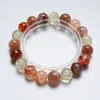 [Atardecer Rosa Naranja] Cristal Natural Negro Oro Super Siete Flor Roja Pegamento Pulsera para Mujer Más Fácil de Combinar Pulsera de Regalo Al por Mayor