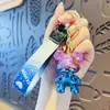 Llavero de oso con graffiti de electrochapado creativo y degradado para coche, muñeco de oso de dibujos animados, colgante para mochila de estudiante, regalo pequeño al por mayor