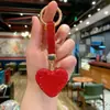 Llavero de Corazón de Amor Nuevo Modelo Incrustado de Diamantes Transfronterizo Colgante para Bolso de Pedrería para Niñas Decoración de Llavero de Coche Venta al por Mayor desde el Fabricante