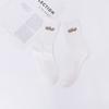 Calcetines mujer Negro y Blanco letras clásicas bordadas calcetines de caña alta hombres y mujeres calcetines para parejas primavera y otoño calcetines altos al por mayor