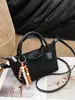 Bolsa de Dumpling Nueva de Otoño e Invierno Transfronteriza Bolsas de Dragón Bolso de Hombro Cruzado Retro Nicho Bolso de Mano de Gamuza de Alta Calidad