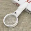Nueva lupa de plástico de mano para lectura con doble lente, dos aumentos y 4 luces LED, raqueta 6B-6B