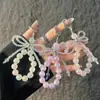 Cadena para teléfono de mariposa de cristal rosa, cordón antipérdida, llavero de alambre de acero de cristal de lujo ligero, exquisito, de alta gama, colgante para bolso