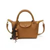 Bolso de mano tejido nuevo transfronterizo para mujer, bolso cuadrado pequeño de moda, sensación de alta gama, bolso de hombro único cruzado, bolso de moda versátil tipo dumpling