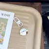 Chaveiro fofo de desenho animado de foca adorável, bolinho de pudim, charme feminino para mochilas de estudantes, presente para melhores amigos