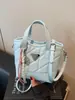 Bolsa pequena popular e moderna para mulheres, bolsa transversal casual versátil nova para o verão de 2026, bolsa de mão estilo coreano tipo balde