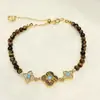 Nuevo Popular Pulsera de Piedra Ojo de Tigre Circonita Nácar Trébol de Cuatro Hojas Lujo Ligero Flor de Cuatro Hojas Joyería de Mano Versátil de Gama Alta