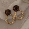 Versáteis brincos ovais geométricos de olho de tigre, um design estiloso e retrô estilo Hong Kong, oferecendo um toque de luxo e sofisticação para mulheres