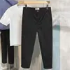 Overol estilo Hong Kong de otoño microelástico holgado recto pequeño pantalones casuales versátiles para hombre cómodos simples pantalones cortos de moda