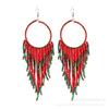 Pendientes de borlas con cuentas de arroz largas estilo étnico bohemio retro, joyería popular europea y americana, suministro transfronterizo para mujer