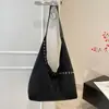 Bolso de mano retro estilo coreano al por mayor, bolso de mujer, nueva colección otoño 2026, color liso, bolso de hombro simple, adecuado para ir al trabajo, se puede llevar debajo del brazo