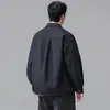 Camisa de mezclilla color original lavada estilo retro americano para hombre, nuevo estilo otoño 2026, corte holgado, cuello de solapa, chaqueta camisa de manga larga