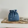 Nuevo bolso tipo cubo vintage simple de principios de otoño de 2026, bolso casual de moda, bolso bandolera para mujer con textura, bolso de mujer al por mayor