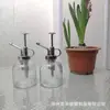Suministro de fábrica regadera regadera botella de vidrio transparente regadera para plantas estilo pastoral utensilios de riego para jardín