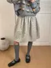 Falda Midi Estampado Floral Otoño 2026 Suelta Moda Versátil Texturizada de Longitud Media con Cintura Elástica y Bolsillos Estilo Coreano Adelgazante