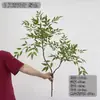 Simulación de una sola exhibición de ventana de ingeniería floral de decoración del hogar de estilo nuevo chino Nantianzhu, simulación de hojas de madera pintadas de verde