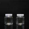 Frasco de Plástico con Forma de 200 ml de Boca Ancha Oblicua para Embalaje de Alimentos Transparente PET Tarro de Dulces Tarro con Botón Oferta