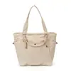 Bolsa de lona de color sólido de gran capacidad para mujer, modelo versátil 2026, bolso de hombro simple para uso casual, clase y bolsa de mano para el trabajo