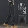 Jeans de lujo para hombre de alta gama, ligeros, pantalones largos rectos holgados, nuevo estilo 2026, pantalones elásticos versátiles casuales azul grisáceo