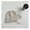 Touca de lã tricotada infantil coreana para outono e inverno, quente, simples, moda curinga, estilo estrangeiro, atacado
