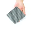 Venta al por mayor de vajilla de silicona de grado alimenticio anti-quemaduras, posavasos para ollas y tazones, sin olores, fácil de limpiar, almohadillas aislantes tipo panal resistentes a altas temperaturas