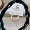 Colgante de cadena para teléfono con cuentas de cristal, decoración de bolso de lazo, llavero para funda de teléfono, correa de muñeca, venta al por mayor de regalos