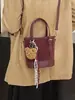 Bolso Cubo de Corazón para Niñas Bolso de Mano de Alta Gama con Textura para Mujer Otoño e Invierno 2025 Bolso Cruzado de Hombro Único de Diseño de Nicho