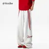 Calça de moletom esportiva listrada estilo americano para homens, nova tendência de rua, modelagem solta, reta, perna larga, versátil, casual, calça longa