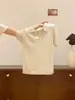 Top de Malha Verão 2026 Estilo College com Recortes Trançados, Gola Polo de Manga Curta para Mulheres, Camisa de Nicho de Alta Qualidade com Caimento Solto