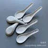 Cuchara de sopa de cerámica desechable de 12,8 cm al por mayor cuchara de cerámica de fondo plano al por mayor cuchara de cerámica de fondo plano al por mayor