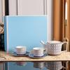 Juego de té de la tarde de porcelana británica de lujo con polvo dorado, taza de café y platillo, ideal como regalo para negocios o para el hogar.