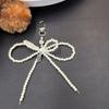 Blogger coreano de ins con diseño nicho, moderno, colgante para teléfono móvil con lazo de doble perla, llavero de corazón