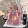 Bolso de Mano Tejido de Punto de Nuevo Estilo Transfronterizo con Diseño de Flor Hueca, Bolso de Regalo Tejido Simple y Versátil de Gran Capacidad