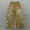 Hecho a medida desde la fábrica de origen, pants de sudor rasgados estilo americano, pants de sudor holgados de pierna ancha pintados a mano, pants de sudor para hombre de moda urbana