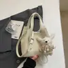 Bolso Canasta de Verduras de Mano de Nicho para Mujer 2026 Primavera Nuevo Temperamento Casual Moda Cubo Bolso Cruzado Serie de Bolsos de Moda