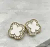 Trébol de Cuatro Hojas Diamante Metal Colgante Chapado Botón Cosido a Mano Camisa Chaqueta de Mujer Traje Chaqueta de Plumas Suéter Botón Estilo Chanel