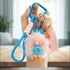 Chaveiro Pingente Menina Cabelo Cacheado Moderno Legal Desenho Animado Boneca Pão de Leite Charme para Bolsa Feminina Argola Pequeno Presente