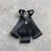 Corbatín estilo coreano Broche de lazo grande para mujer aleación cinta broche satén camisa suéter ropa escote broche venta al por mayor