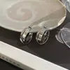 Versión coreana de pendientes de aro de moda otoño e invierno para mujer, pendientes de alto temperamento, estilo Ins, pendientes finos simples, venta al por mayor