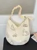 Bolsa tote casual de gran capacidad, bolso de hombro, bolso de mano, nicho transfronterizo, versátil para primavera y verano, tendencia de moda artística estilo coreano