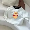 Nueva camiseta base de manga larga para niños 2026 nuevo estilo unisex color block para bebé cuello redondo camiseta top de corazón de dibujos animados primavera y otoño