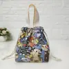 Suministro directo de fábrica bolsa portátil con cordón bolsa de lona portátil monedero para teléfono móvil bolsa pequeña de dibujos animados para mujer bolsa para la compra de mamá
