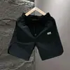 Moda Verão Nova Marca Secagem Rápida Casuais Bermudas Masculinas Modernas Largas Versátil Perfurado a Laser Respirável Seda Gelada Calças