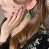 Venta al por mayor de fábrica nuevos aretes chinos para mujer ágata verde calcedonia calabaza aretes de alto sentido aretes colgantes alto sentido