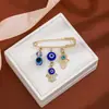 Broche de Borla Ojo del Diablo con Pedrería Creativa Europeo y Americano para Mujer, Pin de Estilo Vintage para Ceñir la Cintura de Suéter Ojo Azul de Alta Gama