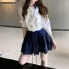 Conjunto de Moda Camisa com Gola Polo de Manga Longa Saia de Cintura Alta em Linha A Curta Estilo Preppy Conjunto de Duas Peças Feminino Primavera