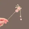 Exquisita horquilla antigua con borla de flor de durazno, simple y moderna horquilla con forma de disco para el cabello, horquilla de alta gama con sentido del estilo cheongsam y hanfu para mujer.