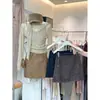 Falda midi de mezcla de lana gris para mujer otoño/invierno 2026, falda corta nueva de cintura alta, falda de invierno súper elegante para combinar con un abrigo