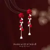 Pendientes de Perlas con Lazo Rojo para Otoño e Invierno Pendientes de Alta Gama para Mujer 2025 Nuevo Estilo Chino Pendientes Rojos